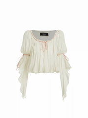 Blusa con volantes, cuello redondo y lazo fruncido en gasa texturizada