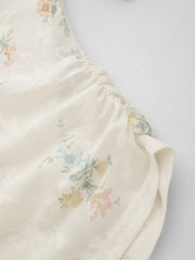 Top de manga larga floral asimétrico con estampado de cuello en barco