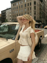 Mid Rise Pleated Tiered Button Mini Skirt